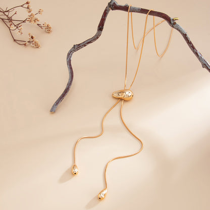 Goldtone Drop Tassel Lariat Necklace, vintage-inspired design, detail close-up