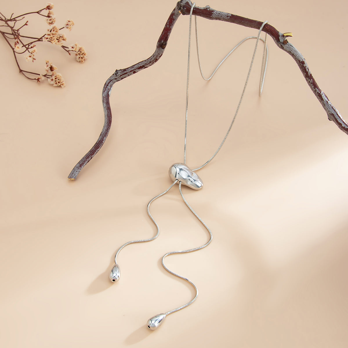 Silvertone Drop Tassel Lariat Necklace, dainty minimalist design, side view