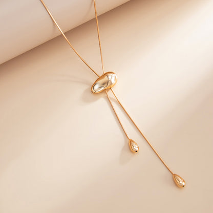Goldtone Drop Tassel Lariat Necklace, vintage-inspired design, side view