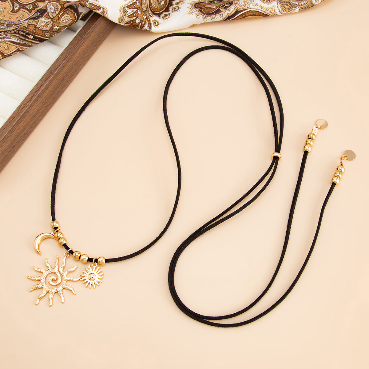 Black Polyster and Goldtone Sun Moon Pendant Necklace, vintage-inspired design, side view