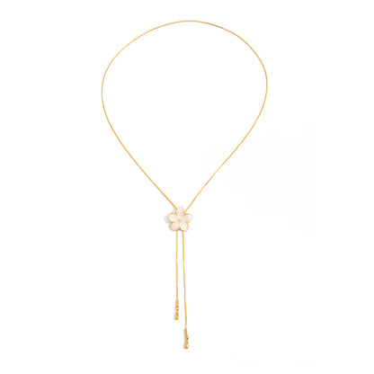 White Enamel and Goldtone Flower Tassel Pendant Necklace, botanical inspired, front view