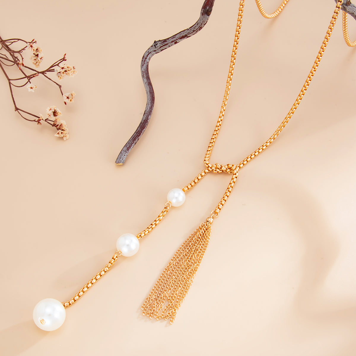 Pearl and Goldtone Tassel Knot Necklace, botanical inspired, side view