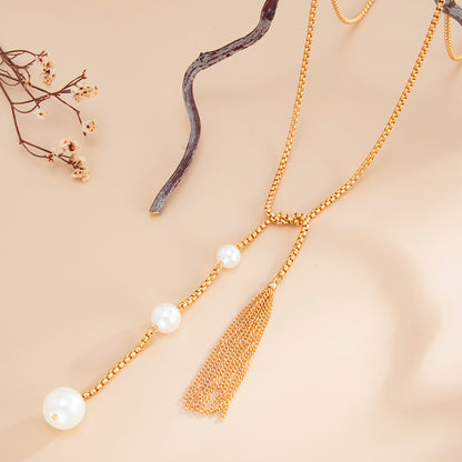 Pearl and Goldtone Tassel Knot Necklace, botanical inspired, side view