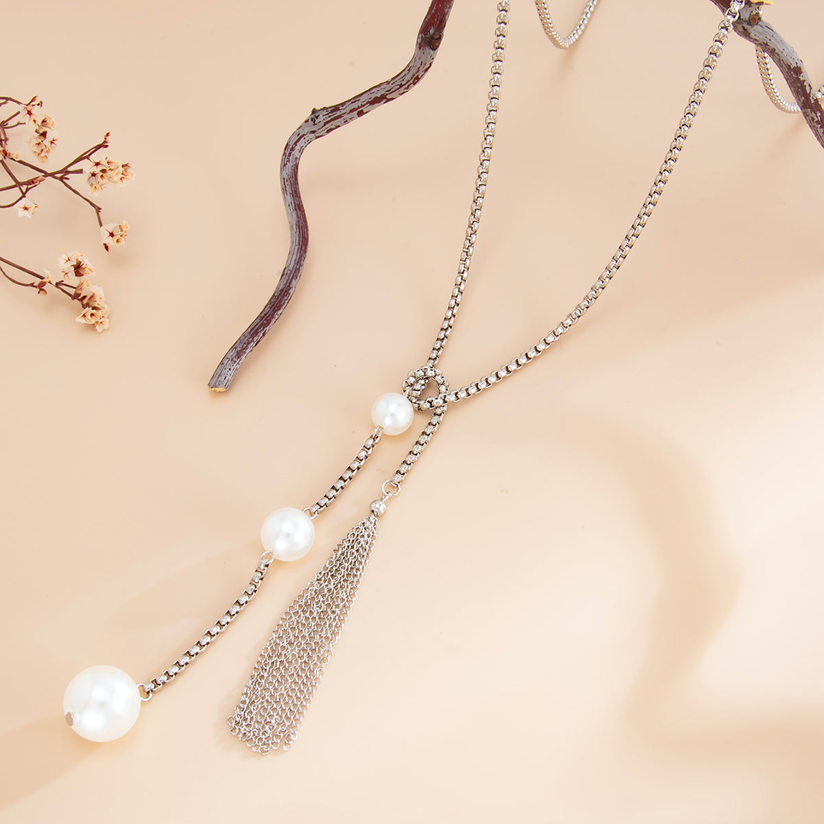 Pearl and Silvertone Tassel Knot Necklace, botanical inspired, side view