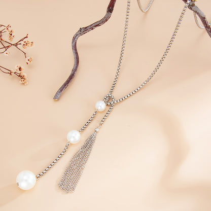 Pearl and Silvertone Tassel Knot Necklace, botanical inspired, side view