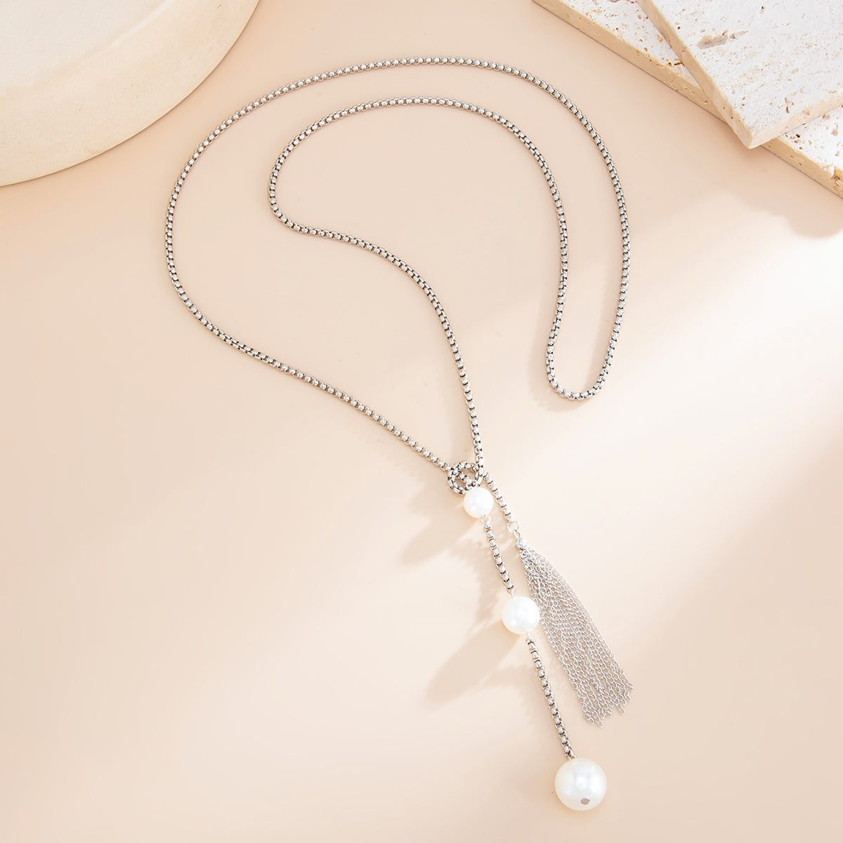 Pearl and Silvertone Tassel Knot Necklace, botanical inspired, detail close-up
