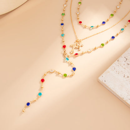 Multi-Colored Crystal and Goldtone Cross Pendant Lariat Necklace Set, gold pendant necklace for women, side view
