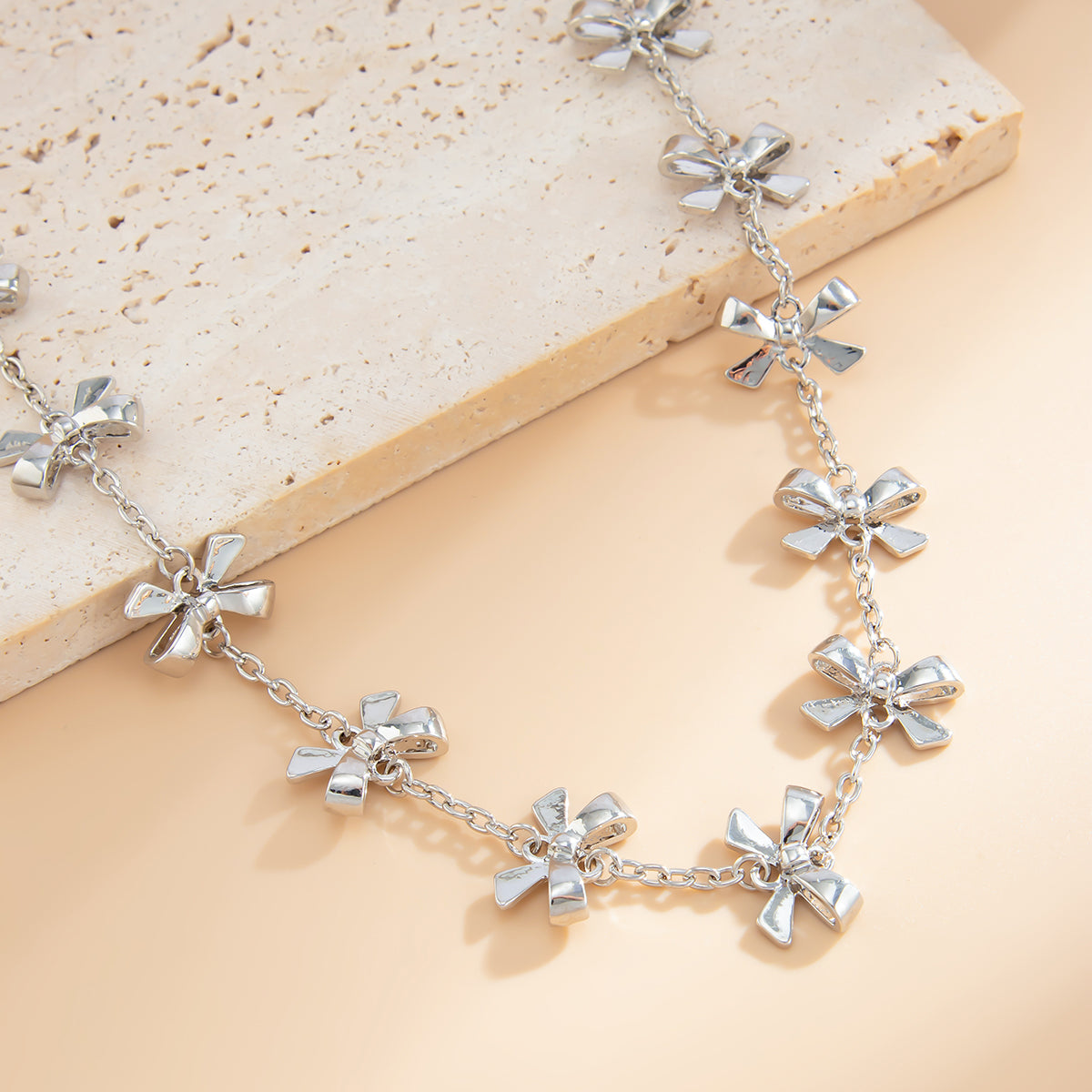 Silvertone Bow Station Lariat Necklace, botanical inspired, lifestyle look
