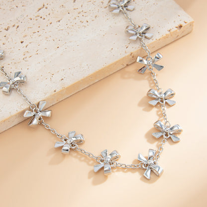 Silvertone Bow Station Lariat Necklace, botanical inspired, lifestyle look