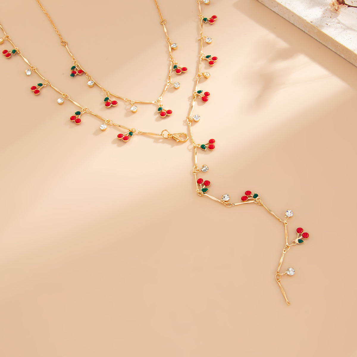 Red Enamel and Cubic Zirconia Goldtone Cherry Station Y-Necklace Set, gold pendant necklace for women, side view