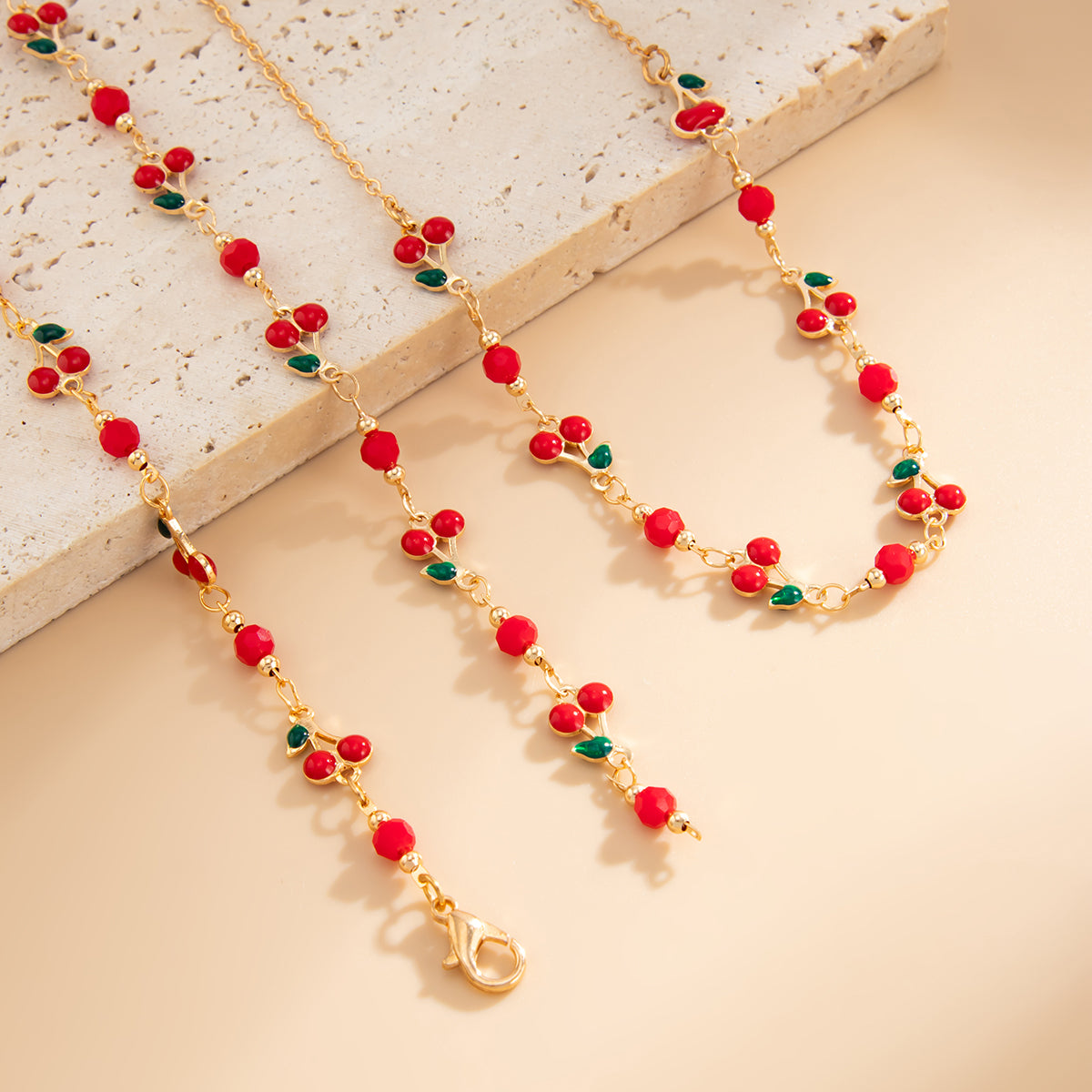Red Enamel and Goldtone Cherry Station Y-Necklace Set, gold pendant necklace for women, botanical inspired, side view