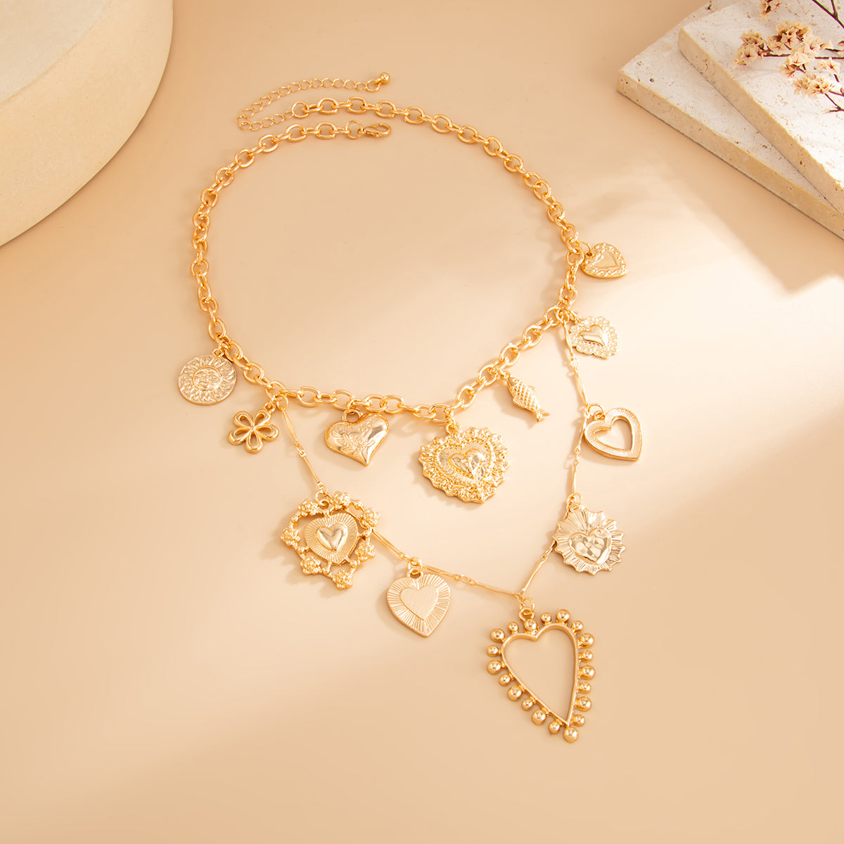 Goldtone Heart Flower Fish Statement Necklace, botanical inspired, side view