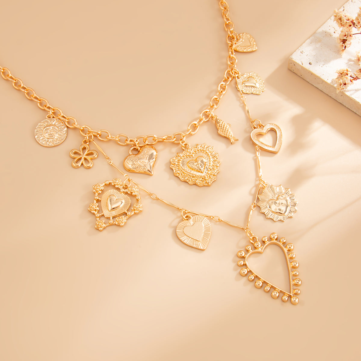 Goldtone Heart Flower Fish Statement Necklace, botanical inspired, detail close-up