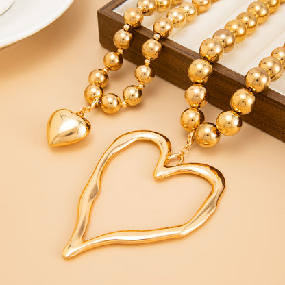 Goldtone Beads Chain Heart Pendant Statement Necklace Set, gold pendant necklace for women, everyday style, side view
