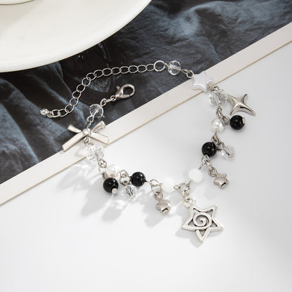 Black Resin and Acrylic Pearl Silvertone Star Bow Charm Bracelet, silver bracelet for women, everyday style, side view