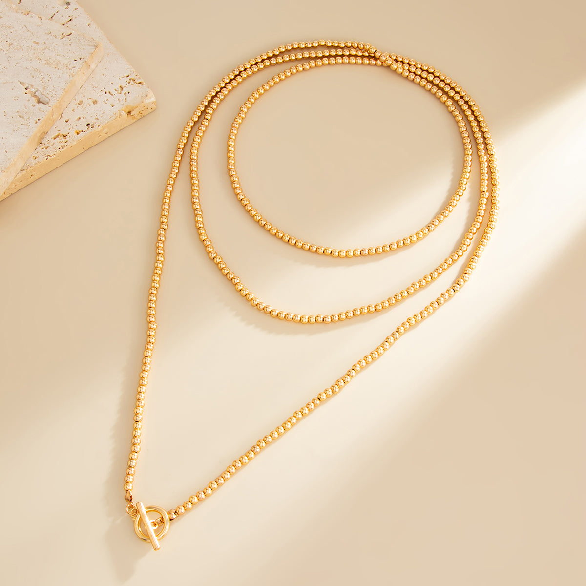 Goldtone Bead Chain Toggle Necklace, dainty minimalist design, side view