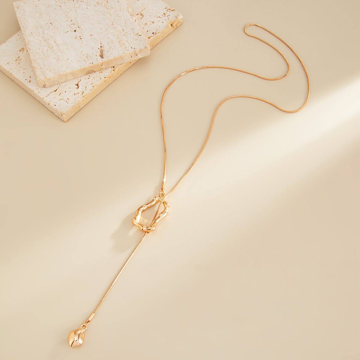 Goldtone Open Irregular Lariat Necklace, botanical inspired, side view