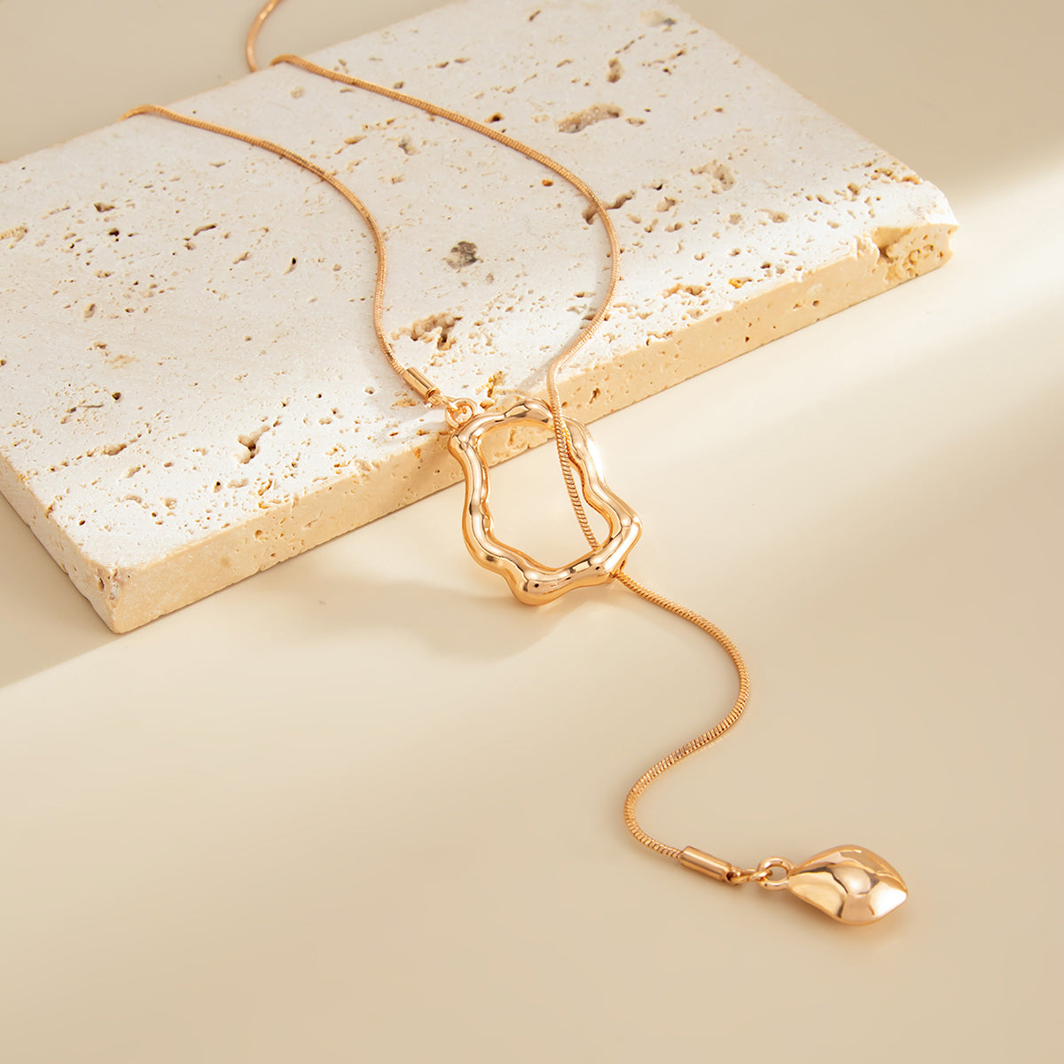 Goldtone Open Irregular Lariat Necklace, botanical inspired, detail close-up