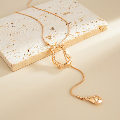Goldtone Open Irregular Lariat Necklace, botanical inspired, detail close-up