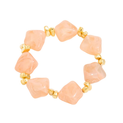 Pink Resin and Goldtone Beads Rhombus Station Stretch Bracelet, vintage-inspired design, front view