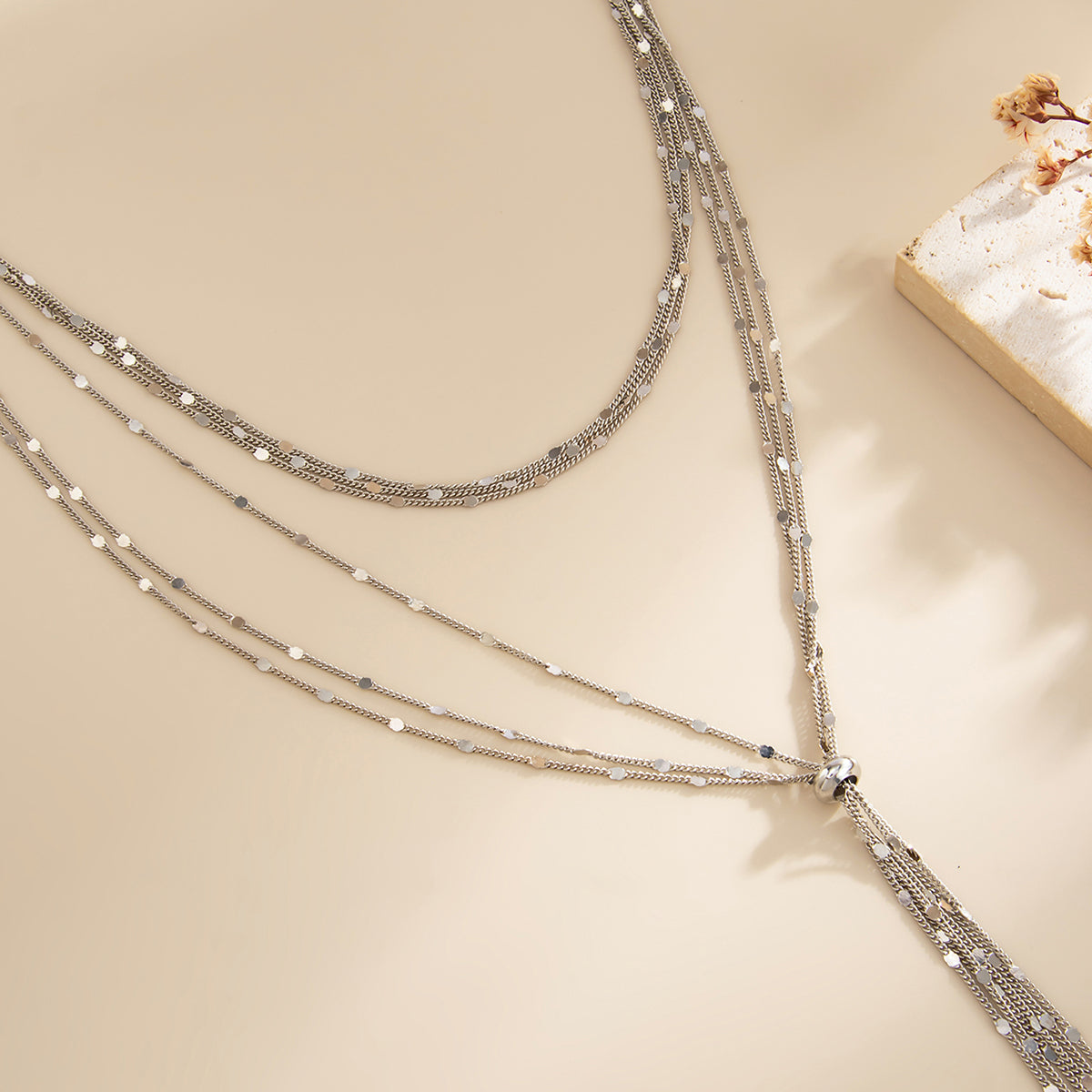 Silvertone Multi-Strand Drop Tassel Necklace, vintage-inspired design, side view