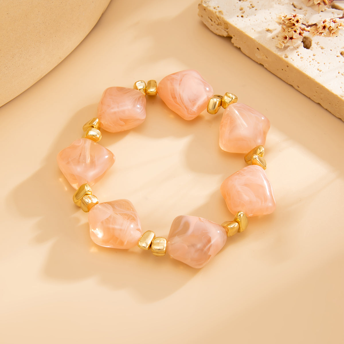 Pink Resin and Goldtone Beads Rhombus Station Stretch Bracelet, vintage-inspired design, side view