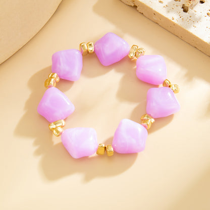 Purple Resin and Goldtone Beads Rhombus Station Stretch Bracelet, dainty minimalist design, detail close-up