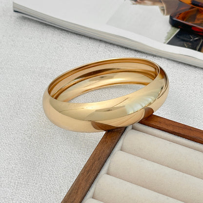 Goldtone Thin Bangle Bracelet, gold bangle bracelet, dainty minimalist design, side view
