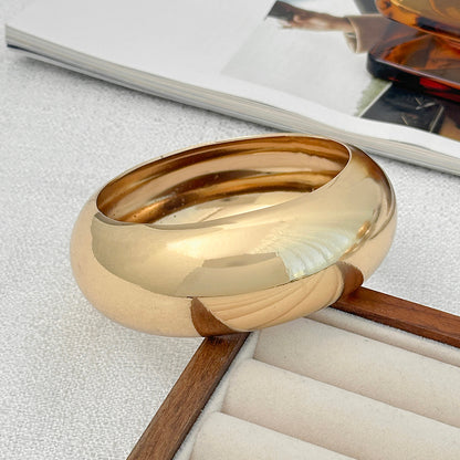 Goldtone Bangle Bracelet, gold bangle bracelet, botanical inspired, side view