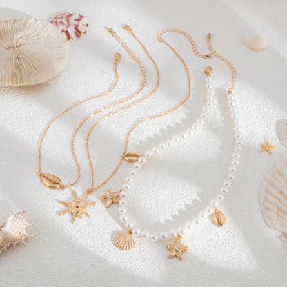 Pearl and Goldtone Sea Lives Pendant Necklace Set, gold pendant necklace for women, botanical inspired, detail close-up