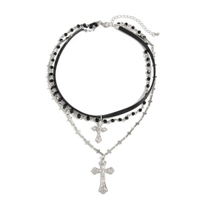 Black Polyurethane and Acrylic Silvertone Cross Pendant Layered Necklace, botanical inspired, front view
