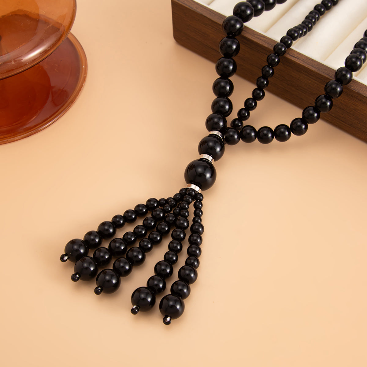 Black Resin and Silvertone Graduated Bead Tassel Layered Necklace, dainty minimalist design, side view