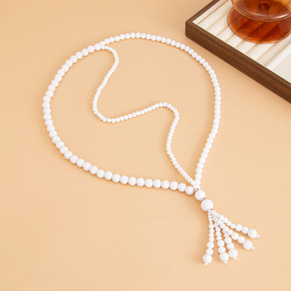 White Resin and Silvertone Graduated Bead Tassel Layered Necklace, vintage-inspired design, detail close-up