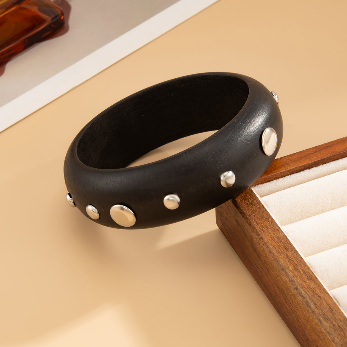 Black Wood and Silvertone Spot Station Bangle, silver bangle bracelet, botanical inspired, side view