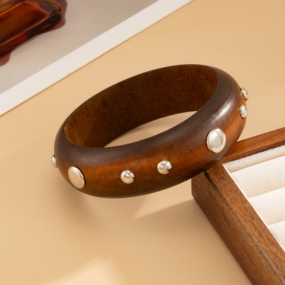 Brown Wood and Silvertone Spot Station Bangle, silver bangle bracelet, botanical inspired, side view