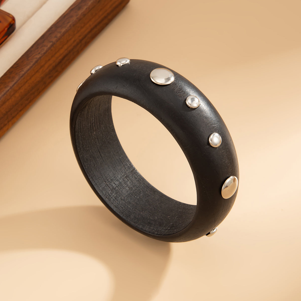 Black Wood and Silvertone Spot Station Bangle, silver bangle bracelet, botanical inspired, detail close-up