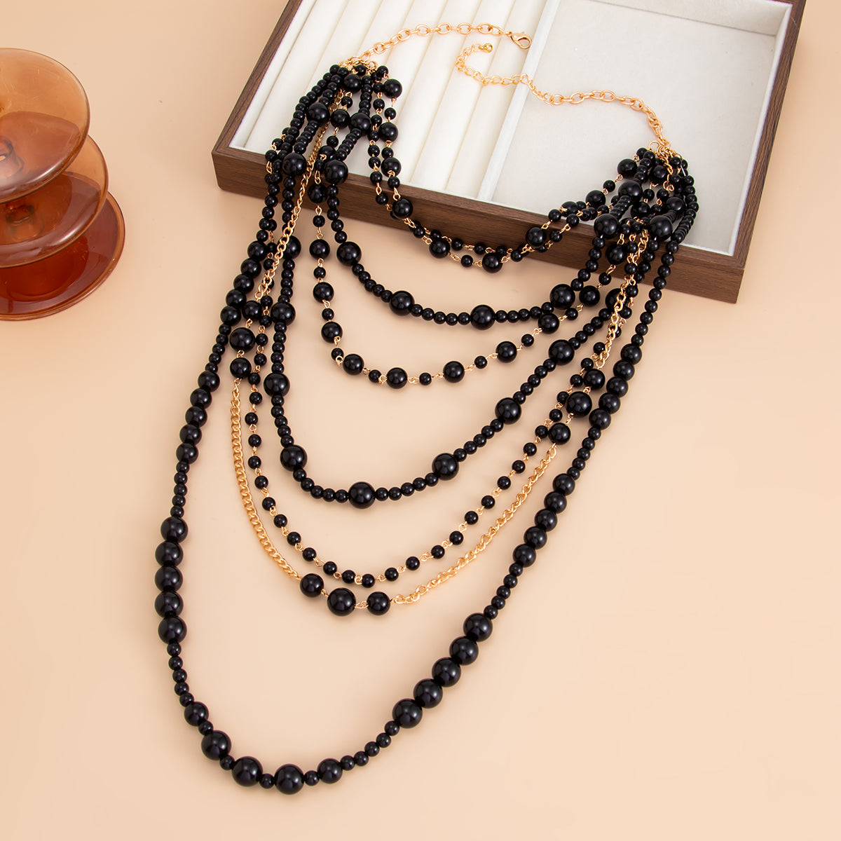 Black Resin and Goldtone Multi-Strand Statement Necklace, botanical inspired, side view