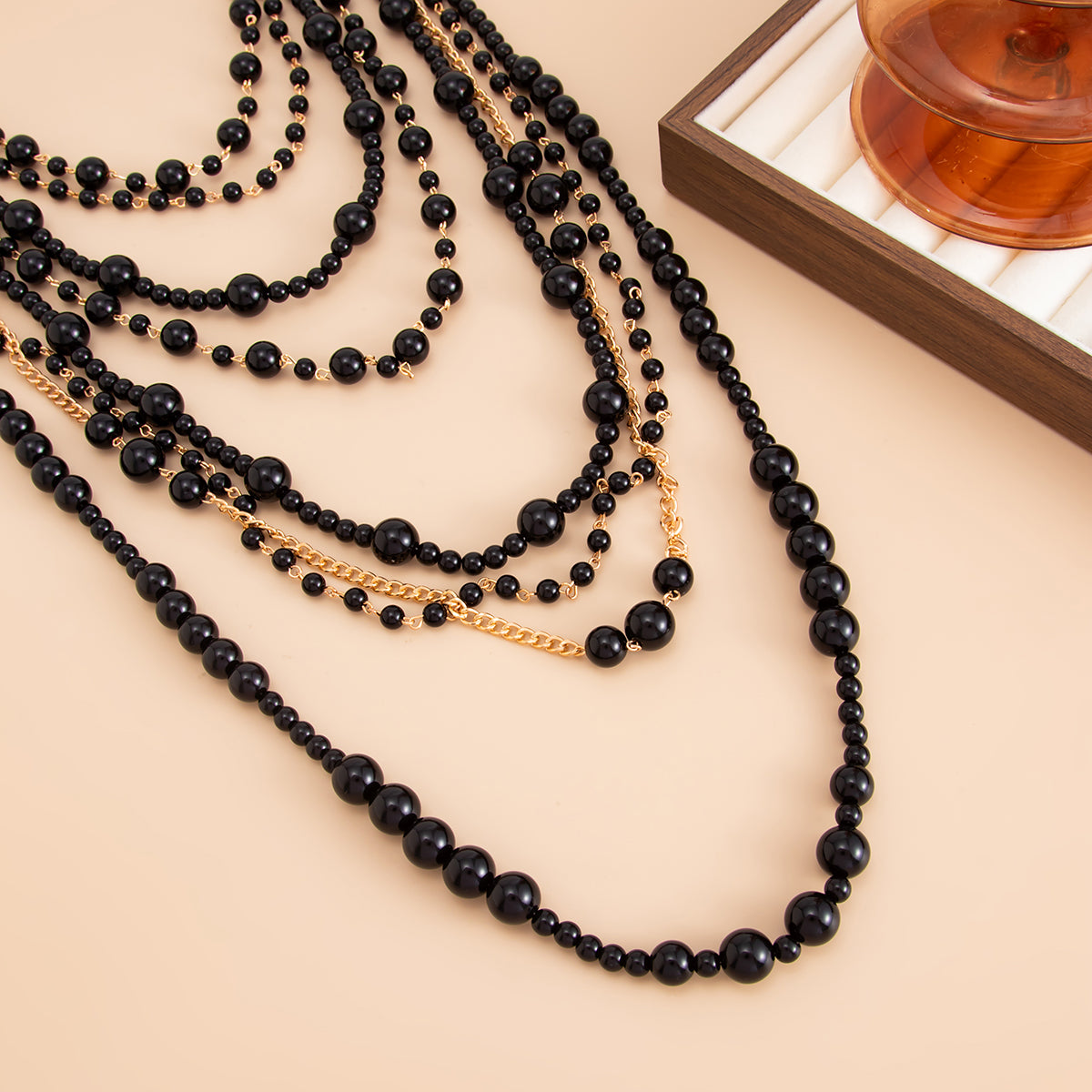 Black Resin and Goldtone Multi-Strand Statement Necklace, botanical inspired, detail close-up