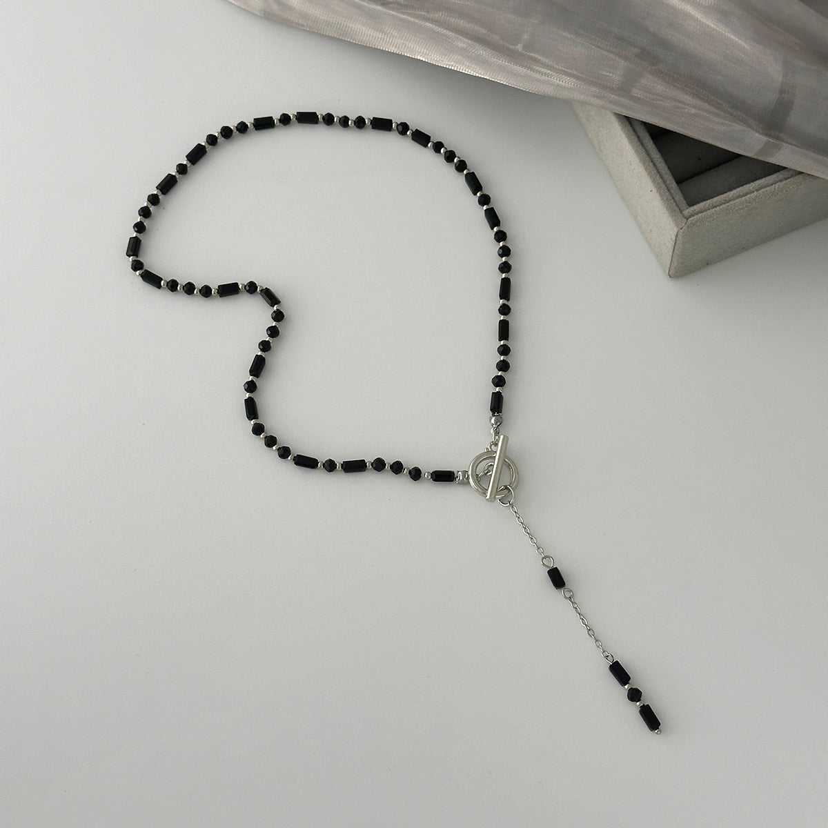 Black Acrylic and Silvertone Drop Toggle Necklace, dainty minimalist design, side view