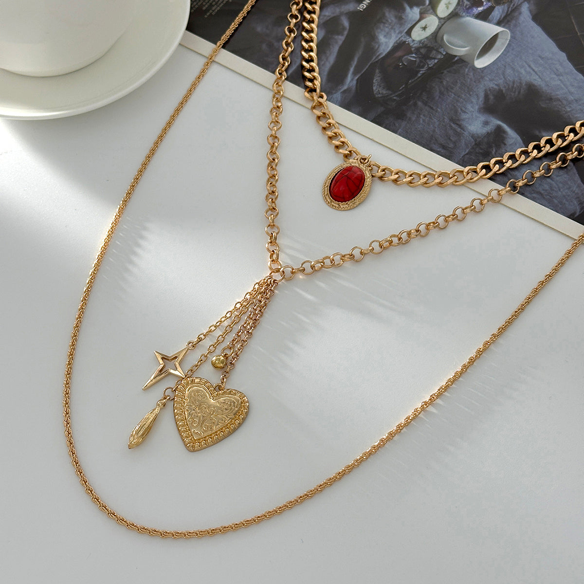 Red Resin and Goldtone Oval Star Heart Pendant Layered Necklace, botanical inspired, side view
