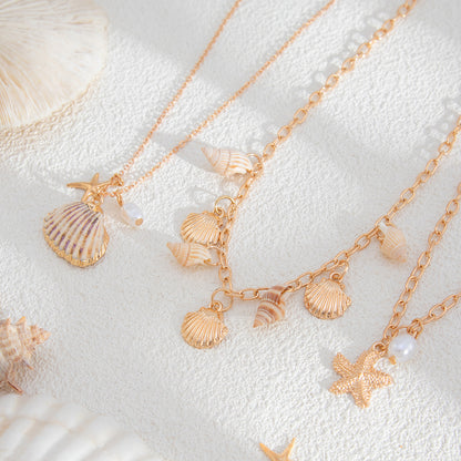 Pearl and Shell Goldtone Sea Lives Pendant Necklace Set, gold pendant necklace for women, detail close-up