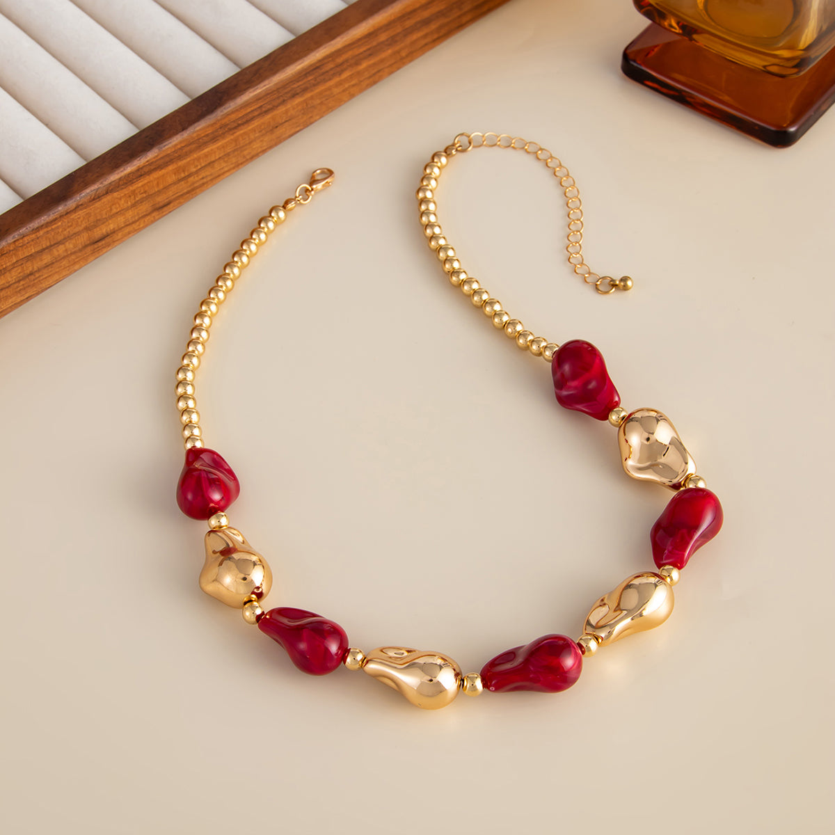 Wine Red Resin and Goldtone Irregular Drop Station Collar Necklace, dainty minimalist design, side view