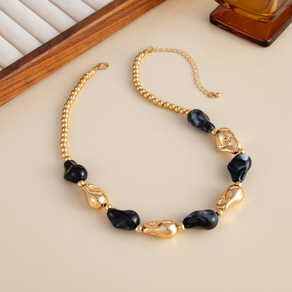 Black Resin and Goldtone Irregular Drop Station Collar Necklace, everyday style, side view