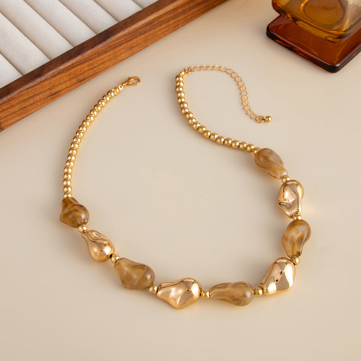 Light Coffee Resin and Goldtone Irregular Drop Station Collar Necklace, dainty minimalist design, side view