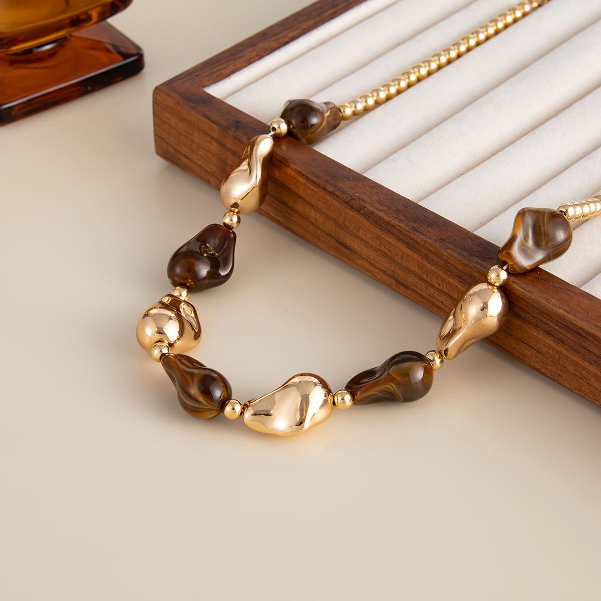Brown Resin and Goldtone Irregular Drop Station Collar Necklace, botanical inspired, lifestyle look