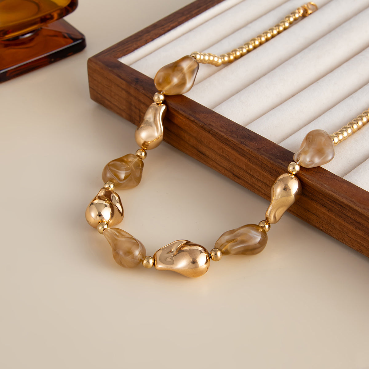 Light Coffee Resin and Goldtone Irregular Drop Station Collar Necklace, dainty minimalist design, detail close-up