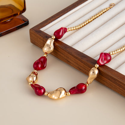 Wine Red Resin and Goldtone Irregular Drop Station Collar Necklace, dainty minimalist design, detail close-up