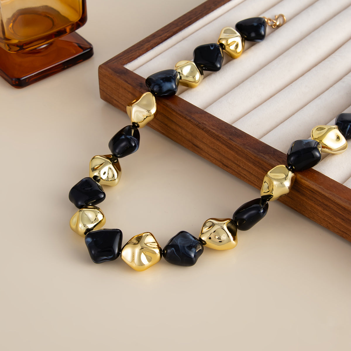 Black Resin and Goldtone Irregular Rhombus Station Collar Necklace, dainty minimalist design, detail close-up