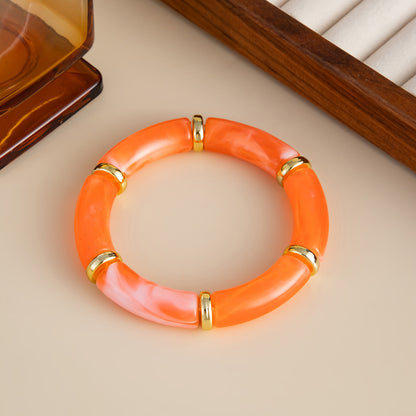 Orange Resin and Goldtone Sequin Joint Stretch Bracelet, dainty minimalist design, detail close-up