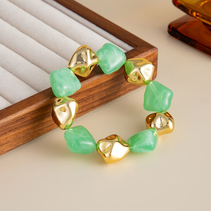 Green Resin and Goldtone Irregular Beads Station Stretch Bracelet, vintage-inspired design, side view